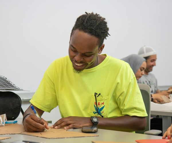 A group of diverse people smiling and feeling energized after a class.
